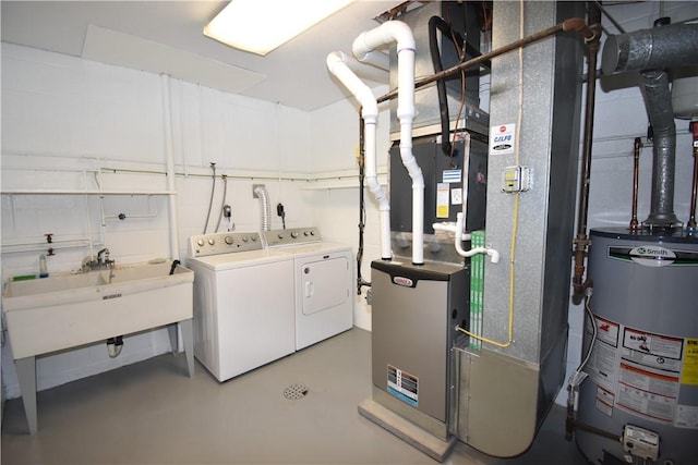 washroom featuring separate washer and dryer, a sink, and gas water heater