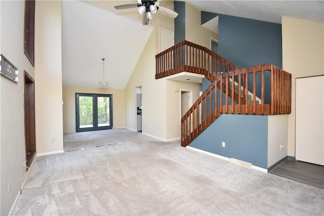 42 Elmhurst St, Green Tree, PA 15220 - unfurnished living room featuring a ceiling fan, high vaulted ceiling, baseboards, carpet floors, and stairs
