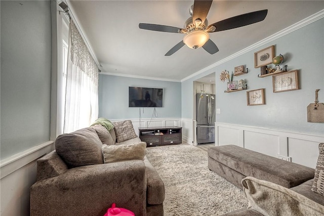 758 Beaver St, Rochester, PA 15074 - carpeted living room featuring crown molding, wainscoting, ceiling fan, and a decorative wall