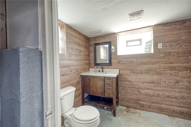 758 Beaver St, Rochester, PA 15074 - half bath featuring toilet, wood walls, unfinished concrete floors, and vanity