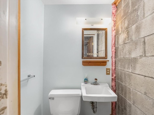 half bathroom with a sink and toilet