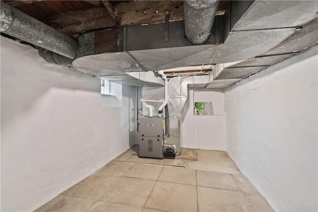 utility room featuring heating unit