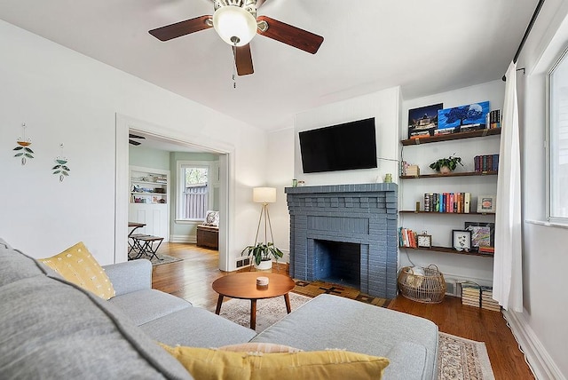 961 Deely St, Greenfield, PA 15217 - living room featuring baseboards, ceiling fan, a fireplace, and wood finished floors