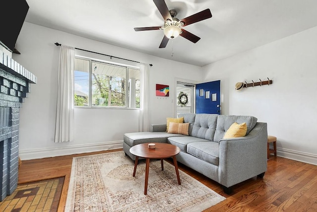 961 Deely St, Greenfield, PA 15217 - living area featuring baseboards, a ceiling fan, wood finished floors, and a fireplace