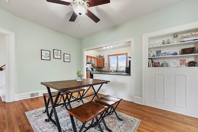 961 Deely St, Greenfield, PA 15217 - dining space with baseboards, a ceiling fan, light wood-type flooring, and visible vents