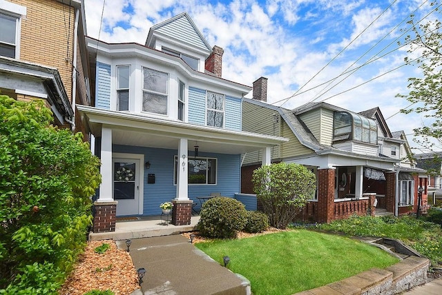 961 Deely St, Greenfield, PA 15217 - view of front of house with covered porch, a chimney, and a front lawn