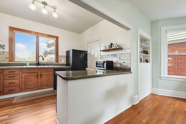 961 Deely St, Greenfield, PA 15217 - kitchen featuring freestanding refrigerator, light wood-type flooring, a sink, and dishwasher