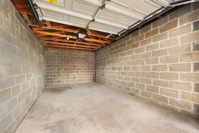 961 Deely St, Greenfield, PA 15217 - garage featuring a garage door opener and concrete block wall