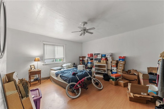 bedroom with ceiling fan and wood finished floors