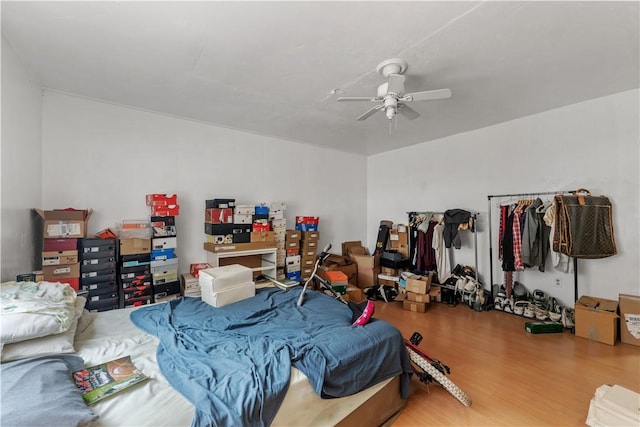 bedroom with ceiling fan and wood finished floors