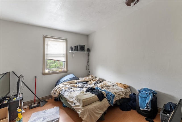 bedroom featuring wood finished floors
