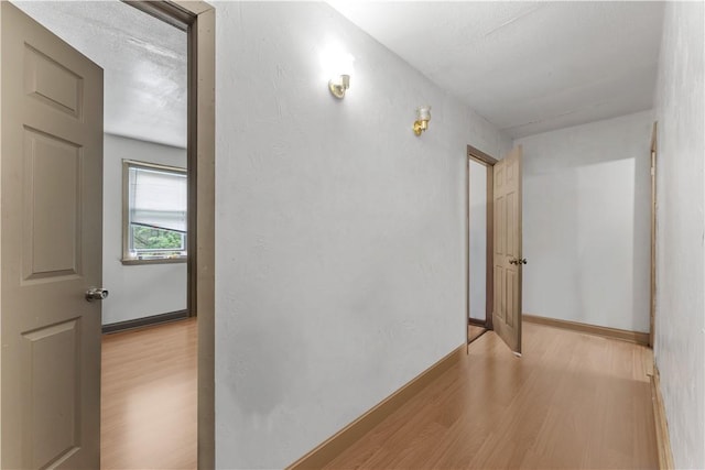 hallway featuring wood finished floors