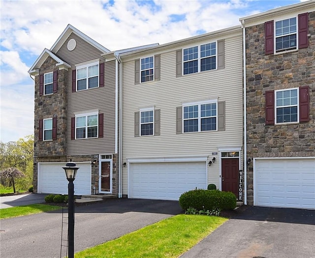 703 Freedom Dr, Collier Twp, PA 15106 - multi unit property with a garage, driveway, and stone siding