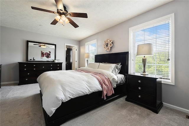 703 Freedom Dr, Collier Twp, PA 15106 - bedroom featuring baseboards, ceiling fan, a textured ceiling, and light colored carpet