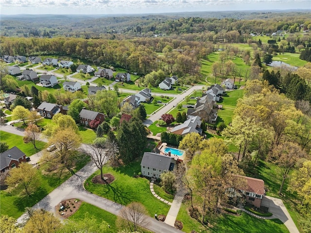 aerial view with a residential view and a wooded view