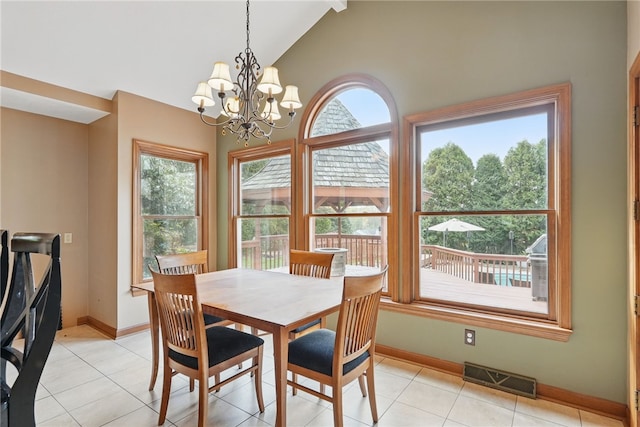 dining space with visible vents, baseboards, light tile patterned flooring, and an inviting chandelier