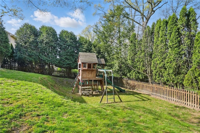 view of play area featuring a yard and a fenced backyard