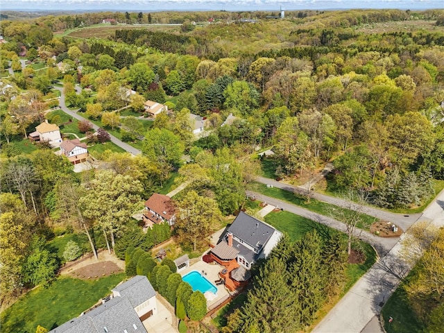 drone / aerial view featuring a view of trees