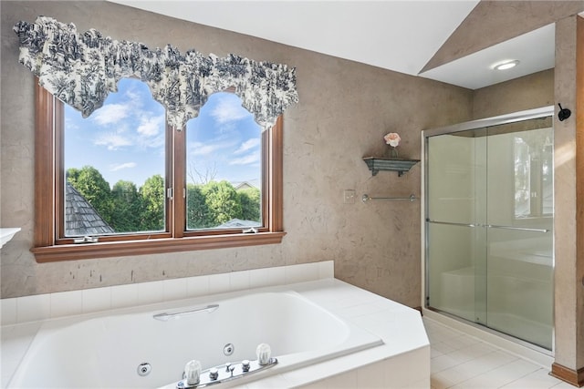 full bath featuring a jetted tub and a shower stall