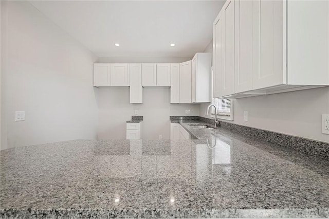 25 Scotia St, Ingram, PA 15205 - kitchen with white cabinets, recessed lighting, stone counters, and a sink