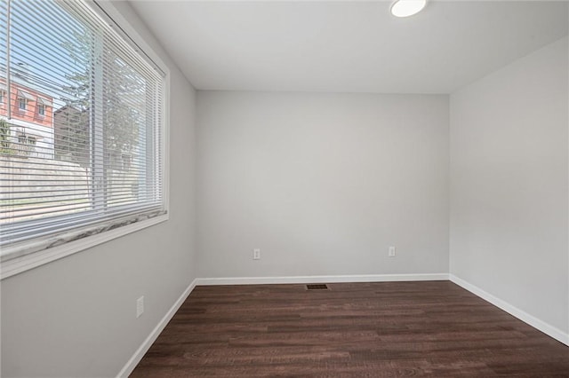 25 Scotia St, Ingram, PA 15205 - unfurnished room featuring plenty of natural light, baseboards, and dark wood-style floors