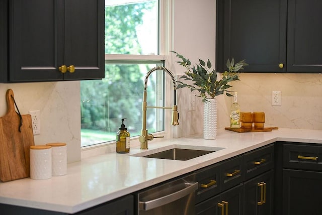 kitchen featuring stainless steel dishwasher and a sink