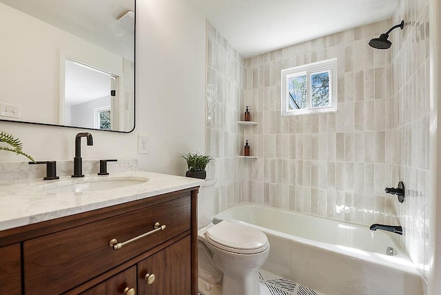 full bathroom with vanity, washtub / shower combination, and toilet