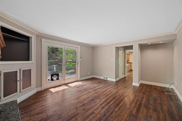 unfurnished living room featuring crown molding, baseboards, visible vents, and wood finished floors
