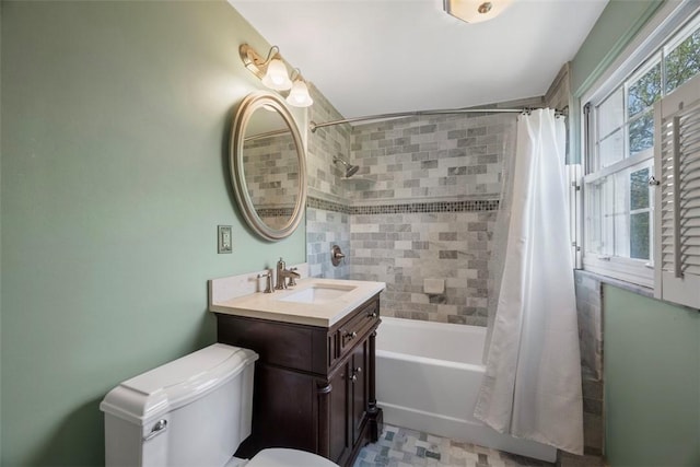 full bathroom with vanity, shower / bath combo, and toilet