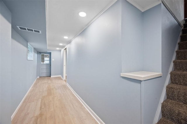 corridor with visible vents, light wood-type flooring, stairway, baseboards, and recessed lighting