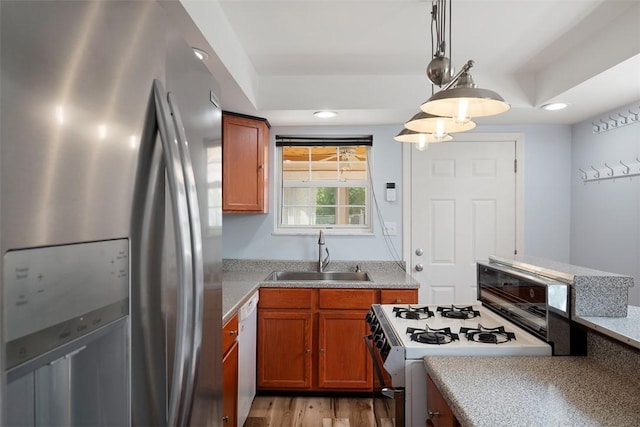 1928 Shamokin, South Side, PA 15203 - kitchen with white appliances, brown cabinets, a sink, and light countertops