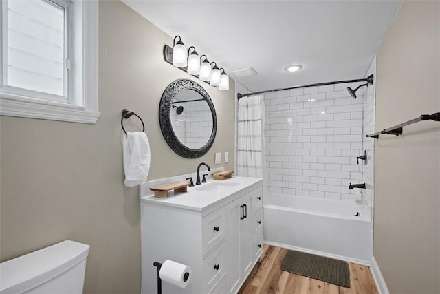 1928 Shamokin, South Side, PA 15203 - bathroom featuring vanity, shower / bathtub combination with curtain, wood finished floors, and toilet