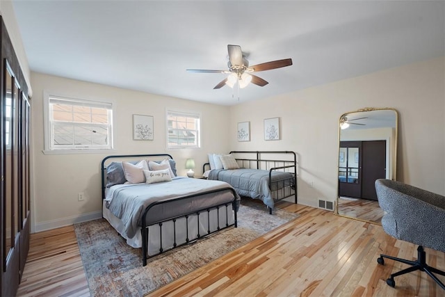 1928 Shamokin, South Side, PA 15203 - bedroom featuring ceiling fan, multiple windows, wood finished floors, and visible vents