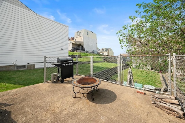 1928 Shamokin, South Side, PA 15203 - view of patio with a grill, fence, a gate, and an outdoor fire pit