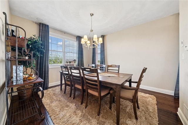 1043 Blackthorne Dr, Penn Twp Wml, PA 15644 - dining area with baseboards, wood finished floors, and a notable chandelier