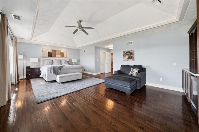 1043 Blackthorne Dr, Penn Twp Wml, PA 15644 - bedroom with visible vents, baseboards, dark wood-type flooring, and a tray ceiling