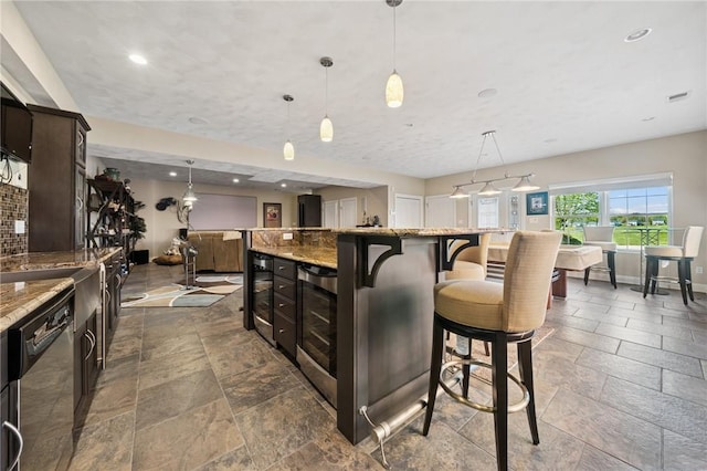 1043 Blackthorne Dr, Penn Twp Wml, PA 15644 - kitchen with a kitchen island, visible vents, dishwasher, stone tile flooring, and wine cooler