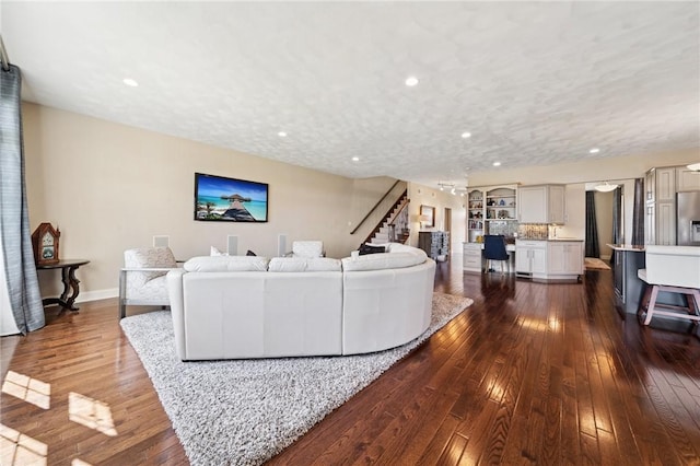 1043 Blackthorne Dr, Penn Twp Wml, PA 15644 - living area with recessed lighting, baseboards, stairs, and dark wood-style floors