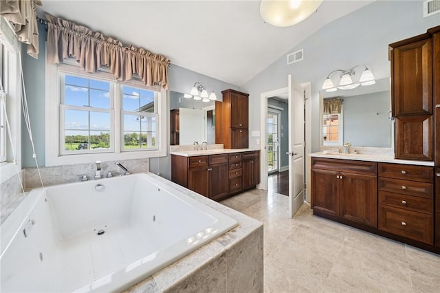 1043 Blackthorne Dr, Penn Twp Wml, PA 15644 - bathroom with visible vents, two vanities, a sink, a whirlpool tub, and lofted ceiling