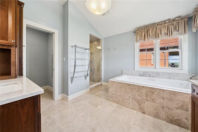 1043 Blackthorne Dr, Penn Twp Wml, PA 15644 - full bath featuring a bath, a stall shower, vanity, tile patterned floors, and lofted ceiling