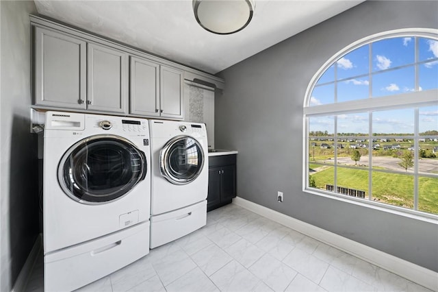 1043 Blackthorne Dr, Penn Twp Wml, PA 15644 - washroom featuring cabinet space, baseboards, washer and clothes dryer, and marble finish floor