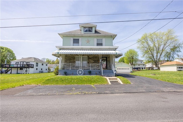 14 Cedar St, Masontown, PA 15461 - view of front of home with a porch, a garage, and a front lawn