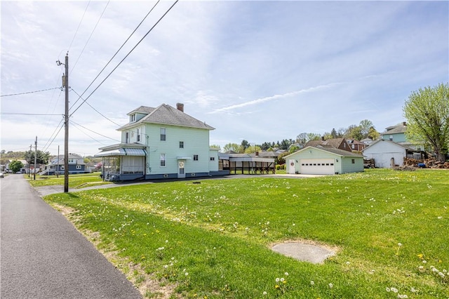 14 Cedar St, Masontown, PA 15461 - view of front of house with a garage, a residential view, and a front yard