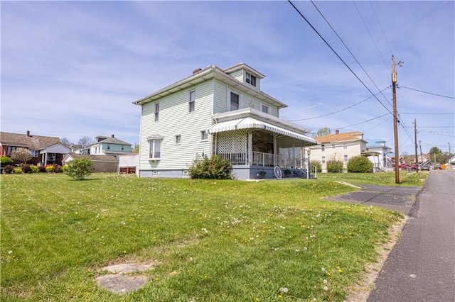 14 Cedar St, Masontown, PA 15461 - exterior space with a lawn and covered porch