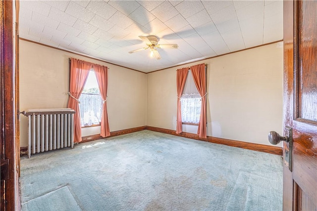 14 Cedar St, Masontown, PA 15461 - carpeted empty room featuring radiator, ornamental molding, baseboards, and ceiling fan