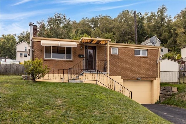 406 Tintsman Ave N, Versailles, PA 15137 - single story home with a garage, fence, a chimney, and a front yard