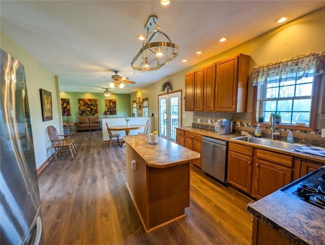 91 Green Manor Dr, Summit Twp But, PA 16002 - kitchen featuring brown cabinetry, a sink, dark wood finished floors, and appliances with stainless steel finishes