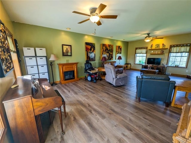 91 Green Manor Dr, Summit Twp But, PA 16002 - living area with baseboards, ceiling fan, a fireplace, and wood finished floors