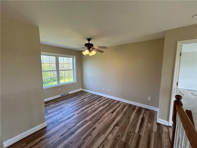 91 Green Manor Dr, Summit Twp But, PA 16002 - empty room featuring baseboards, visible vents, and dark wood-type flooring