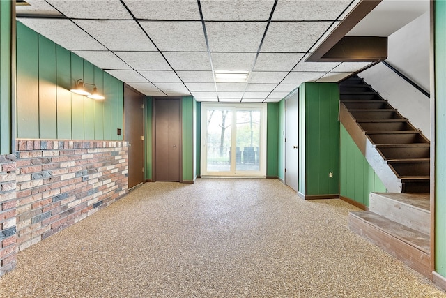 935 Broglie, South Park, PA 15236 - below grade area featuring baseboards, brick wall, a paneled ceiling, and stairway